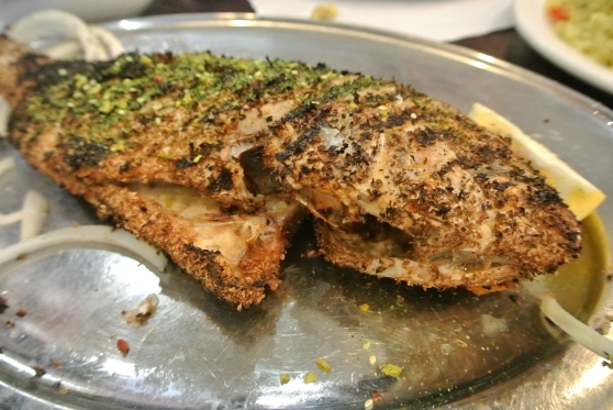 A whole grilled fish with spices