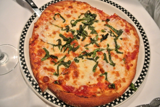 The Classic Pizza -  our classic tomato sauce with fresh basil and mozzarella cheese